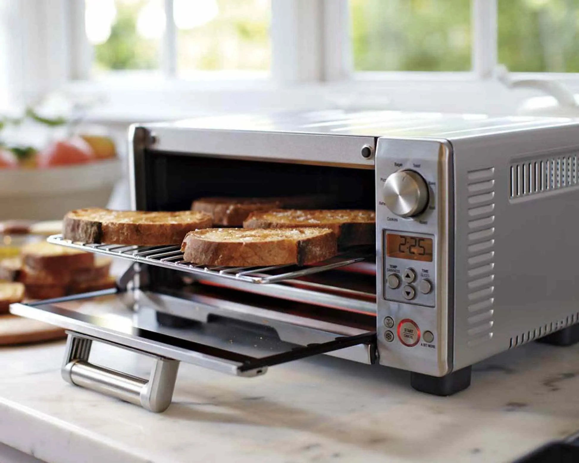 Breville Mini Smart Oven BOV450XL brushed stainless steel countertop toaster oven with Element iQ system and 8 cooking functions