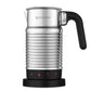 Nespresso Aeroccino 4 silver electric milk frother with ergonomic handle and chrome jug on kitchen counter