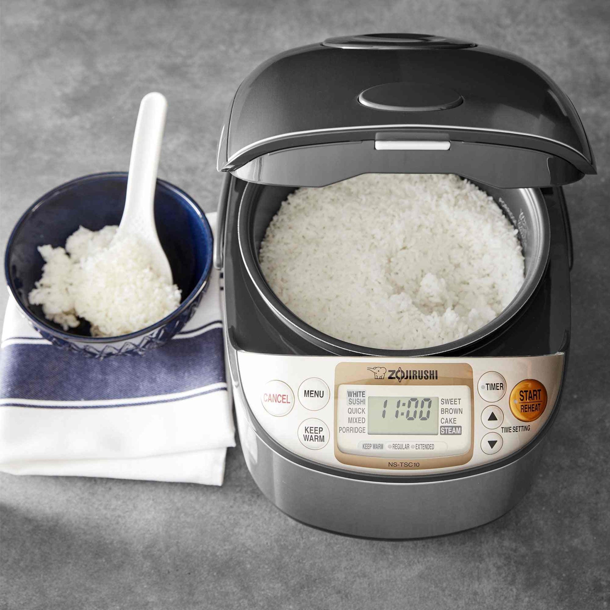 Zojirushi NS-TSC10 Micom rice cooker with fuzzy logic, steaming basket, and LCD display