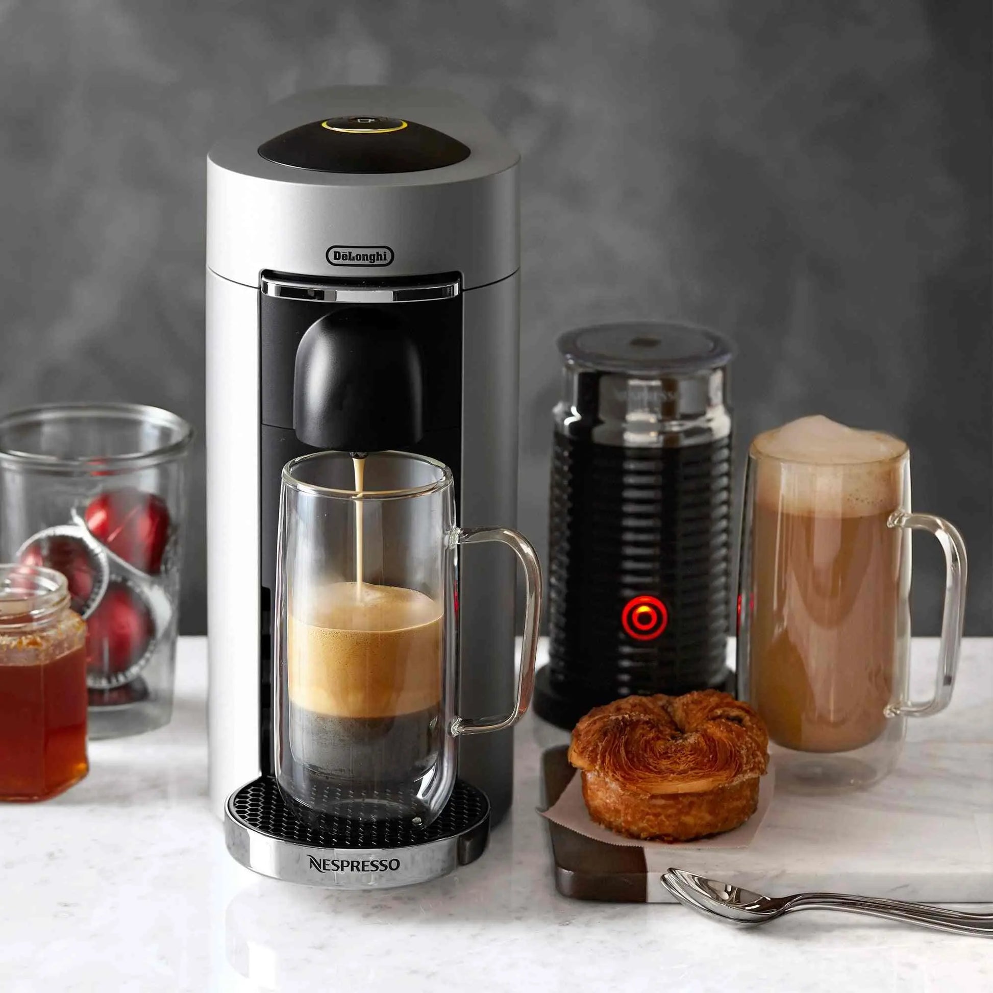 Nespresso VertuoPlus Deluxe coffee maker with Aeroccino milk frother brewing espresso and coffee