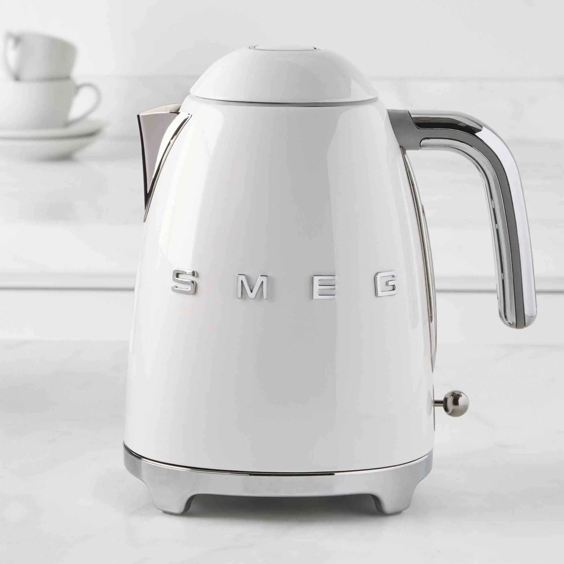 SMEG Electric Kettle with 360-degree swivel base, auto-shutoff, water-level indicators, gentle steam release, and removable limescale filter