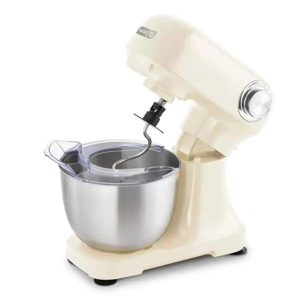 Dash Tilt Head 3.5qt 12-speed stand mixer in cream with stainless steel bowl and three attachments