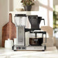 Technivorm Moccamaster KBGV coffee maker brewing with 10-cup glass carafe and brew volume selector switch